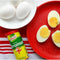 Knorr Aromat seasoning with boiled eggs on a red plate.