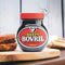 Beefy Bovril 250g jar on a wooden board with a sandwich, showcasing its versatility as a spread and cooking ingredient.