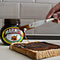 Marmite Yeast Extract being spread on toast.