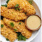 Robertsons Gold 'n Crispy chicken tenders on a plate with dipping sauce.